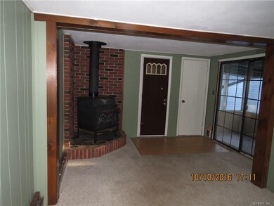 entry with sliding doors to enclosed porch