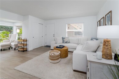 Living room featuring baseboards, visible vents, l
