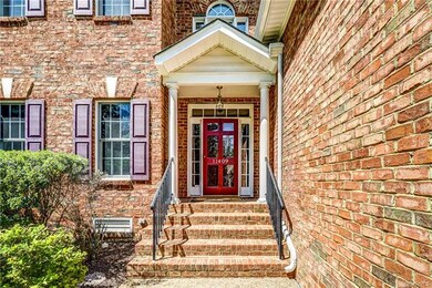 Covered front portico with transom windows, storm 