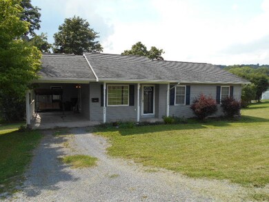 Carport with storage room at end