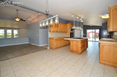 Kitchen with ceiling fan, pendant lighting, light 