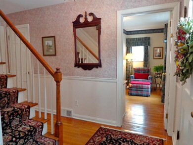 Inside the front entry, arrive into the foyer  wit