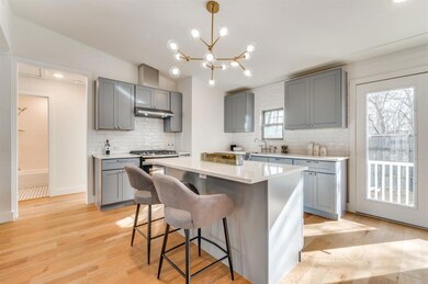 The kitchen provides ample storage and an ideal la