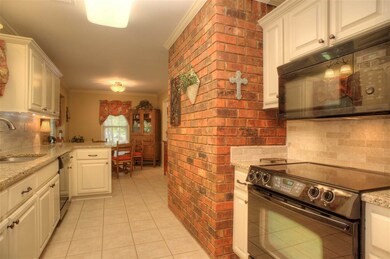 Renovated Kitchen Features Granite, Custom Tile Ba