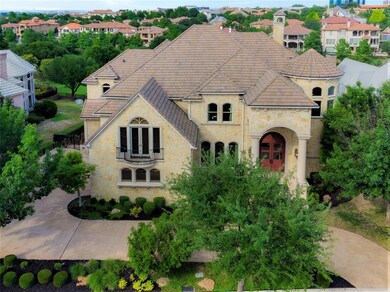 Stone custom home in behind the gates at The Encla