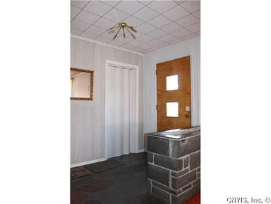 Foyer. Slate flooring and planter box