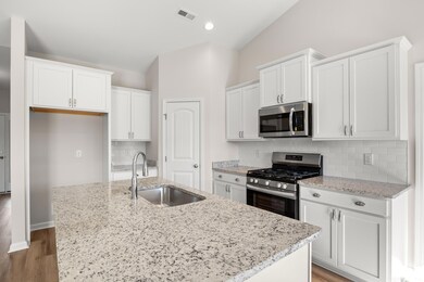 Kitchen with sink, hardwood / wood-style floors, a