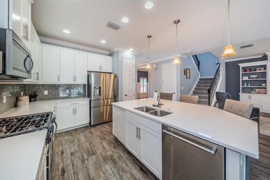 Gleaming Quartz Counters & Upgraded Appliances