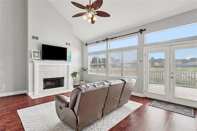 Open living area with tall ceilings and lots of na