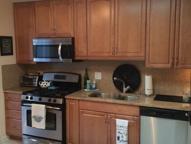 Granite countertops, beautiful backsplash and stai