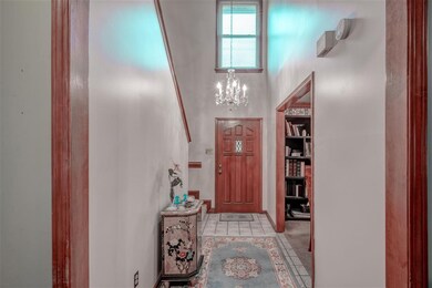 Two story entry with tiled floor and lots of natur
