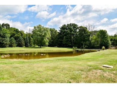 On 3.25 acres with a pond!
