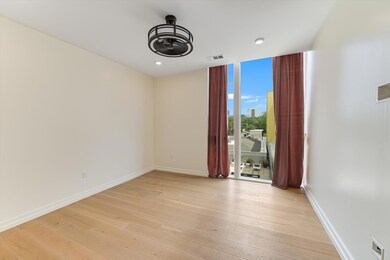 Empty room with expansive windows, baseboards, vi