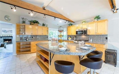 Huge gourmet kitchen with center island and vaulte