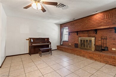 Custom brick work surrounds the fireplace in forma