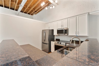Kitchen featuring appliances with stainless steel