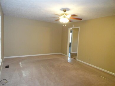 Another view of living room looking into the kitchen area.