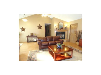 HUGE living room features two ceiling fans, vaulte