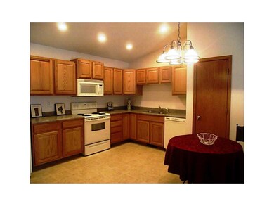 Kitchen. Another angel for dining area with pantry