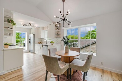 Dining room with light wood finished floors, base