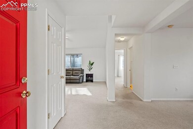 Foyer with light carpet