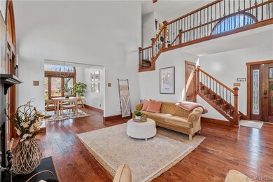 Living room featuring a towering ceiling and dark