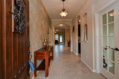 Beautiful entryway with high ceilings and crown molding.