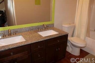 Downstairs bathroom with dual vanity sinks