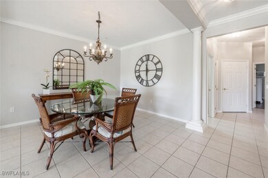 Tiled dining room featuring ornate columns, an inv