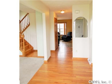 Foyer. The welcoming foyer is Spacious &  sunny! This space offers two coat closets and is open to the formal Dining Room & Living Room.