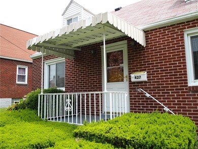 This brick home features a lovely covered front po