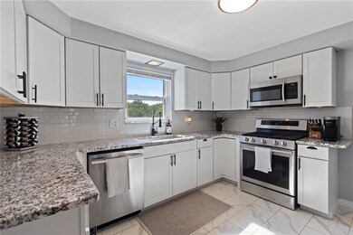gorgeous new kitchen loaded w/ cabinets and granit