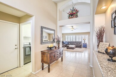 Entry with garage door and laundry room on left -