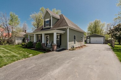 204 College St has so much to offer. From the large detached, insulated shop to the rocking chair front porch, you'll enjoy this convenient, established area. (Photo from previous listing with permission).