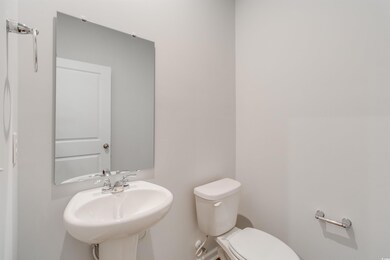 Bathroom featuring a sink and toilet