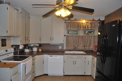 Ceramic tile and painted cabinets.