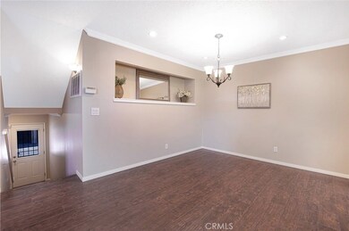 View to stairs to rear exit and garage access.
