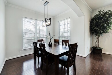The formal dining area fills with natural light fr