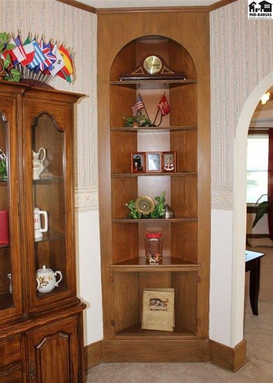Quaint corner display shelving in the dining room.