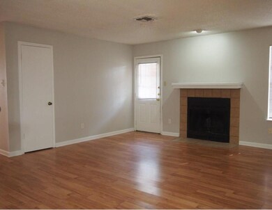 Unfurnished living room with wood finished floors