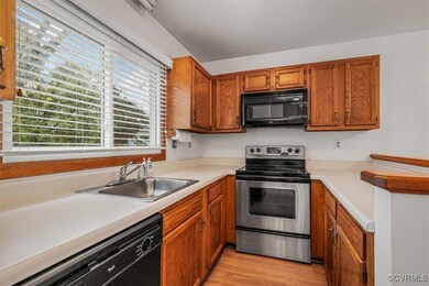Kitchen featuring sink, light wood-type flooring,