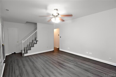 Unfurnished living room with wood-type flooring an