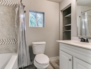 Bathroom with vanity and shower / tub combo