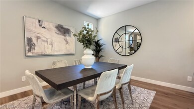 Dining area with baseboards and wood finished floors
