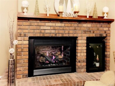 Gas fireplace with remote start and wine cooler in