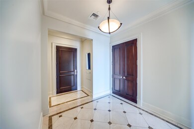 Foyer featuring crown molding