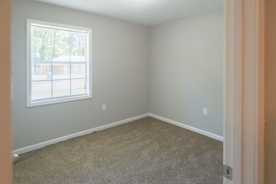 Unfurnished room featuring carpet
