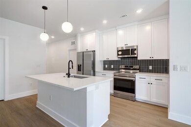 Kitchen featuring stainless steel appliances, a s