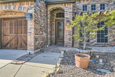 Doorway to property featuring a garage