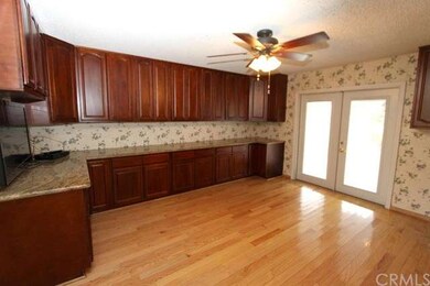 Dinning Room has Hardwood Floor and Double Doors l